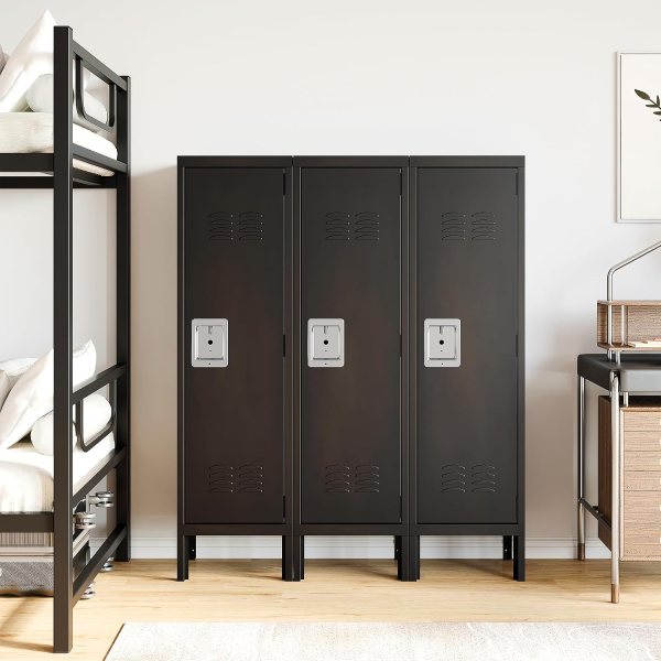 Black metal storage lockers with ventilation and lockable doors in a modern space.