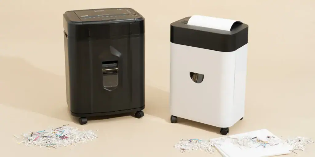 Two Lambock paper shredders in black and white for secure document disposal.