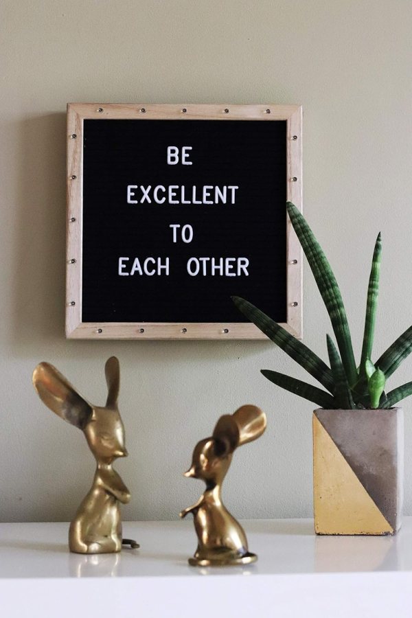 LED message board with motivational quote and decorative bunny figurines.