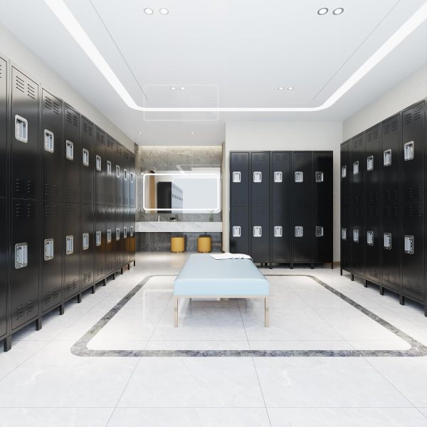 Modern black lockers in a sleek office locker room with seating area.