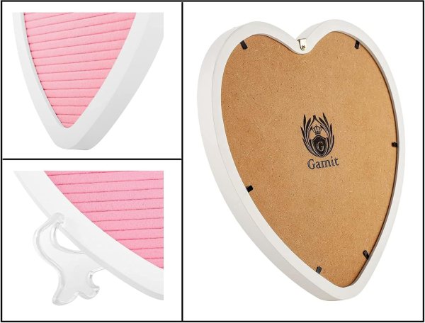 Heart-shaped letter board with pink felt surface and white frame.