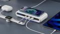 Charging station with smartphone, smartwatch, and tablet connected.