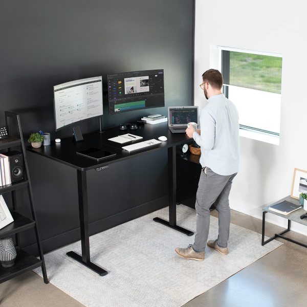 Adjustable standing desk with preset controller, black tabletop, and sturdy black frame for ergonomi.