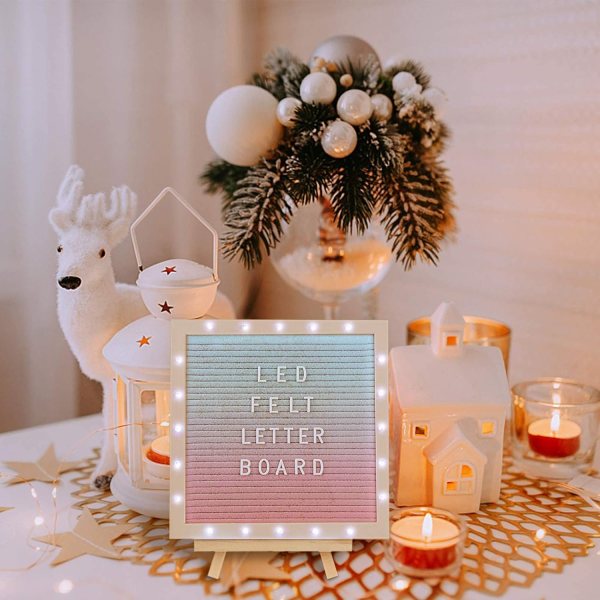 Decorative LED felt letter board with Christmas ornaments and candles.