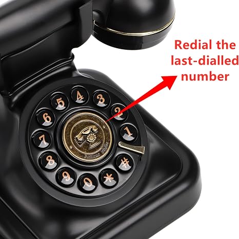 Vintage rotary phone with black and gold accents, adjustable ringer volume, and classic button diali.