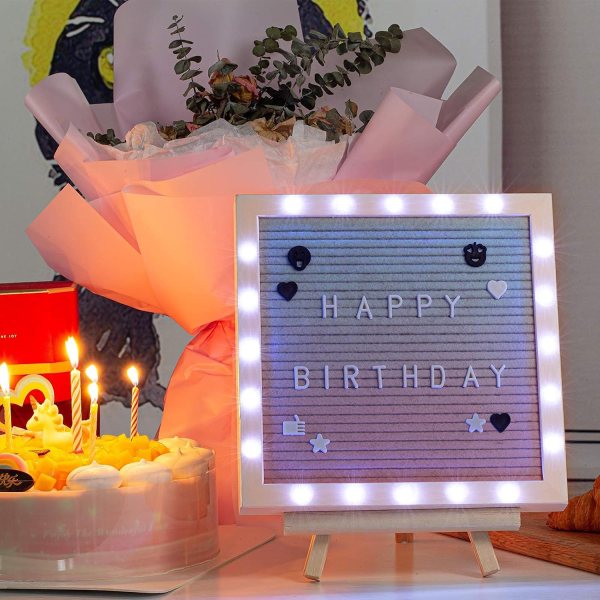 LED felt letter board with birthday message and decorative lights.