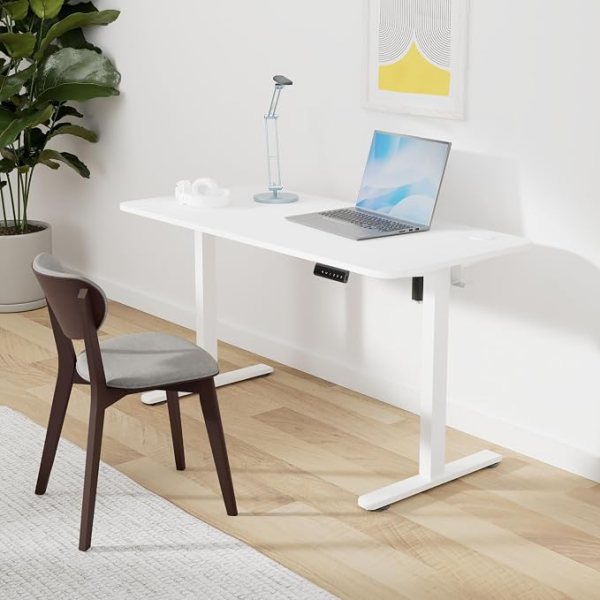 Adjustable height sit-stand desk with sturdy frame, perfect for home office setup and ergonomic work.