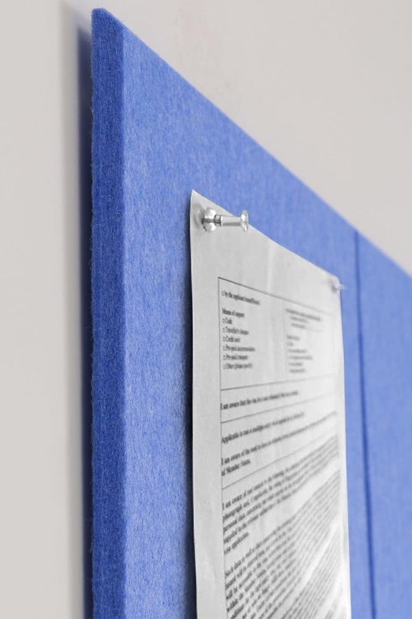 Blue felt wall panel with paper pinned for notes and memos.