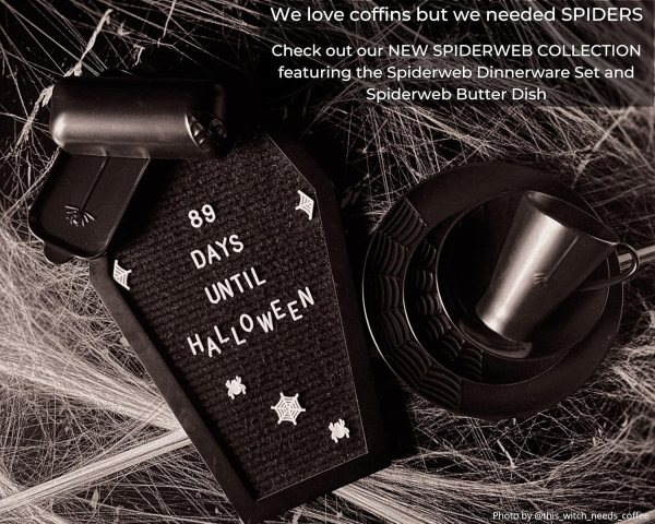 Spooky Halloween message board with white letters and spiderweb decor.