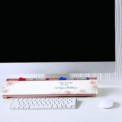 Sleek glass whiteboard with floral design and hidden storage for office or home.