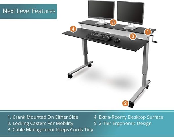 Ergonomic standing desk with dual monitors and adjustable height for improved workspace comfort.