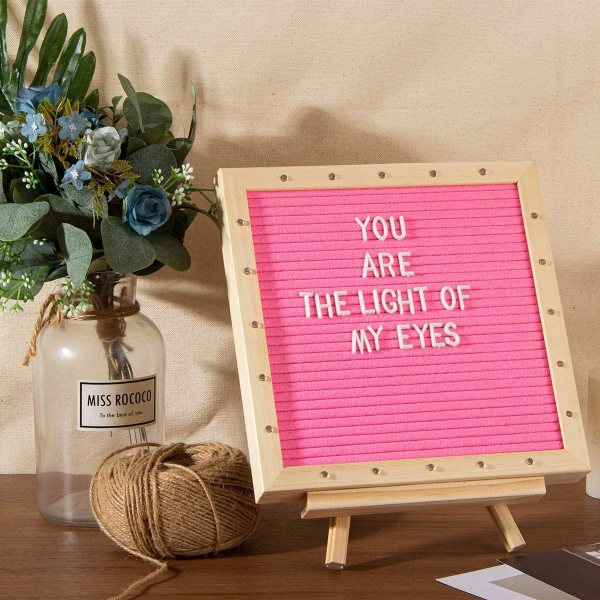 Pink felt letter board with LED lights displaying a romantic message.